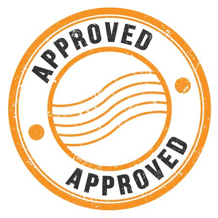APPROVED orange black grungy round stamp.の写真素材