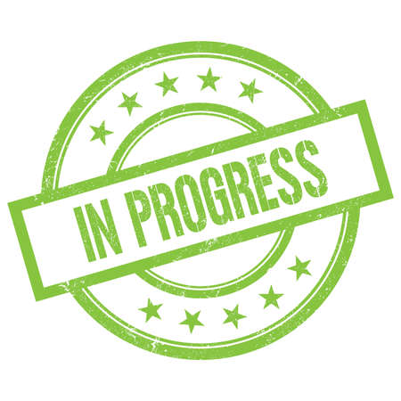 IN PROGRESS text written on green round vintage rubber stamp.の写真素材