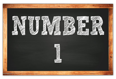 NUMBER 1 written on black wooden frame school blackboard