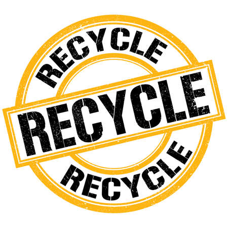 RECYCLE text written on yellow-black round stamp signの写真素材