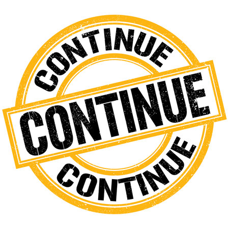 CONTINUE text written on yellow-black round stamp signの写真素材