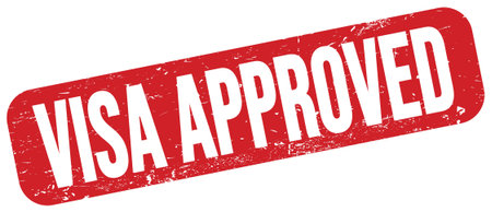 VISA APPROVED text written on red grungy stamp sign.の写真素材