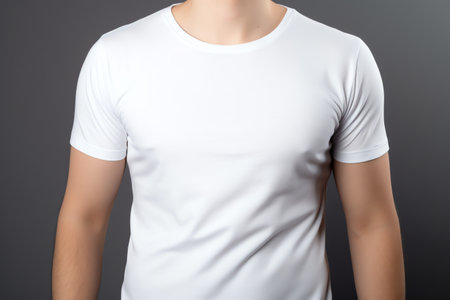Men's white t-shirt on a gray background. Close-up.の素材