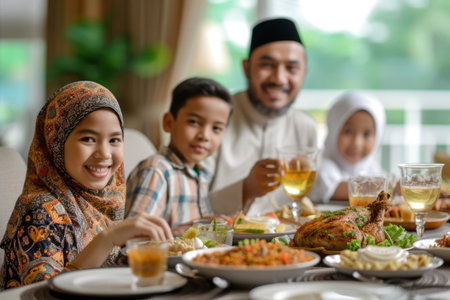 Photo of an Islamic family eating togetherの素材