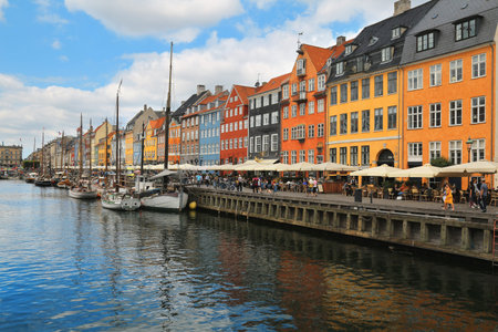 Copenhagen, Denmark - Jun 13, 2018 - Scenic summer view of Nyhavn pier with color buildings, boats...