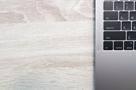 laptop on wood backgroundの写真素材