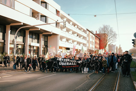 Darmstadt, Germany - 03.03.2023 - Fridays for Future Global Climate Strike, protestors march through the streets of Darmstadt with a huge bannerのeditorial素材