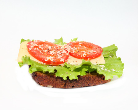 delicious sandwich with cheese, lettuce and tomatoの写真素材