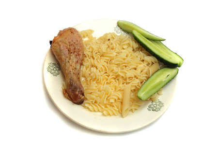 delicious pasta dinner with chicken and fresh tomatoesの写真素材