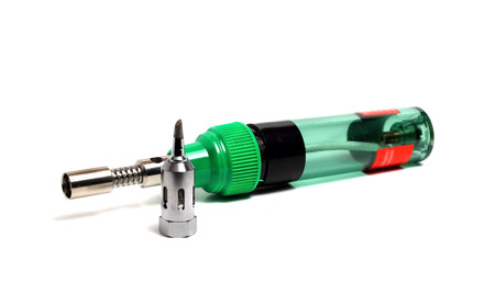 compact handheld gas soldering iron on a white backgroundの写真素材