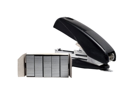 old dusty black office stapler with straps