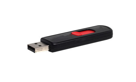 black USB flash drive on a white background
