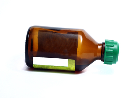 a small brown bottle for medicines on a white backgroundの写真素材