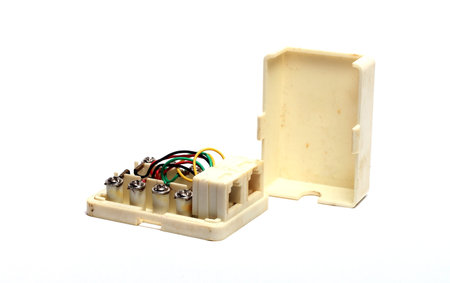 old yellowed phone socket on a white backgroundの写真素材