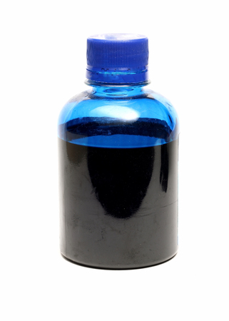 bottle with blue paint isolated on white backgroundの写真素材