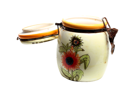 old ceramic jar for loose products on a white backgroundの写真素材