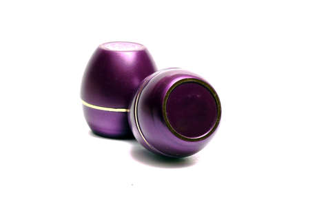 small violet container of cosmetic means on a white backgroundの写真素材
