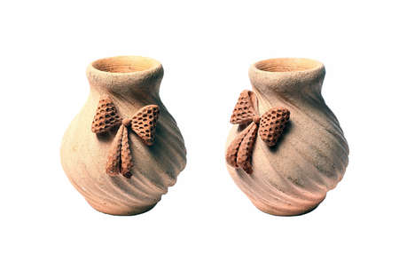 two small clay bowl with a bow on a white backgroundの写真素材