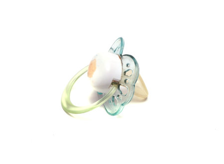 dirty blue pacifier on a white background