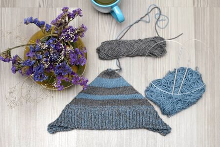 composition of tea and a bouquet of knittingの写真素材