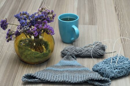 composition of tea and a bouquet of knittingの写真素材