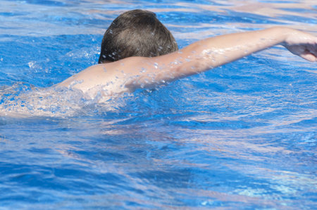 Picture of a boy on a swimming pool 