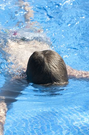 Picture of a boy on a swimming pool の写真素材
