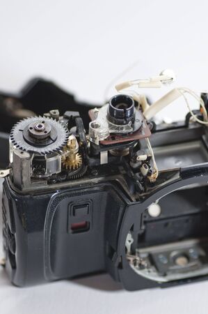 Broken camera picture over white background.の写真素材