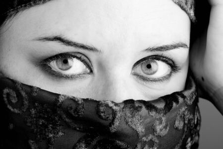 Arab woman wearing veil, black and whiteの写真素材