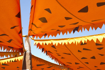 cartoonish orange awning to prevent the sunshine from entering the open spaceの写真素材