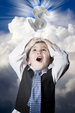 child dressed like businessman with hands on head and dollar signの写真素材
