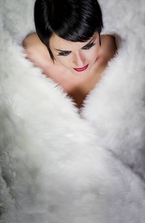 20s style beautiful brunette female wearing fur, swan lookingの写真素材