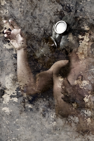 Artistic portrait with textured background, man with gas maskの写真素材