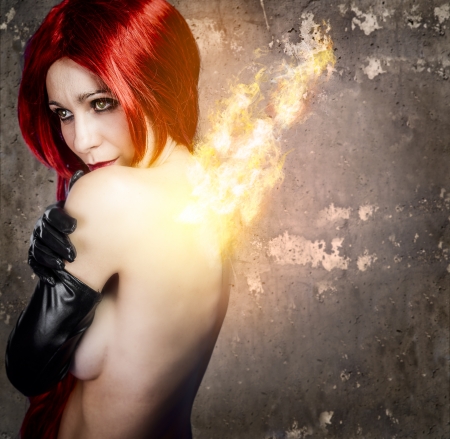 Nude beautiful woman in fireの写真素材