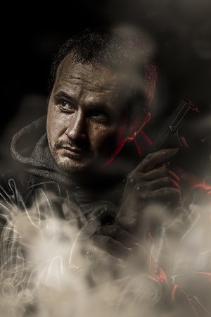 Retro man with a gun ready to shootの写真素材