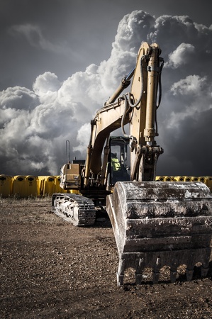 Recycling crane, industrial area over cloudy spaceの写真素材