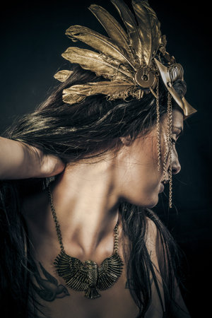 Indian sensual woman with golden mask, ancient goddessの写真素材