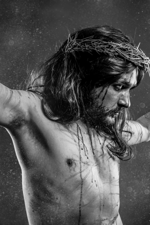 Jesus Christ calvary, man bleeding, representation of passion with crown of thornsの写真素材