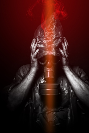 Toxic attack. A man in a gas mask in the smoke. artistic backgroundの写真素材