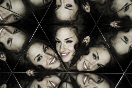 Fashion smile, Beautiful brunette woman dressed Japanese style, formed by mirrors,  into kaleidoscopeの写真素材