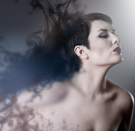 beauty concept, beautiful brunette woman with smooth skin and perfectの写真素材