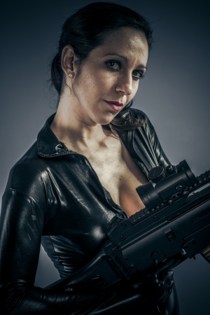 Criminal, Sexy girl military woman posing with guns.の写真素材
