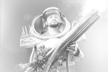 Space, Astronaut on a black background with huge weapon.の写真素材