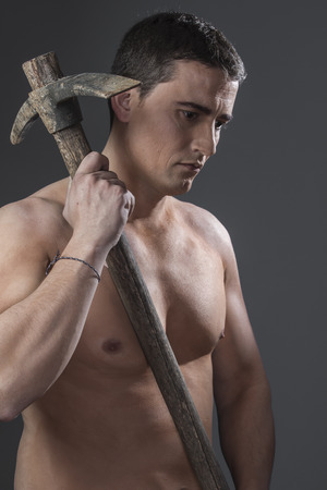 Construction worker portrait holding a peak.の写真素材