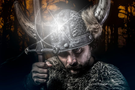 War, Viking warrior, male dressed in Barbarian style with sword, beardedの写真素材
