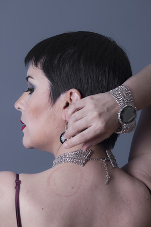 Beautiful brunette woman in lingerie and jewelryの写真素材