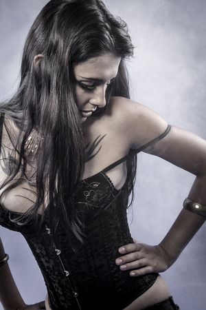 Sensual brunette dressed in black lingerie, studio shootの写真素材