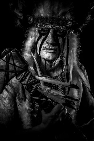 American Indian chief with big feather headdress, warrior