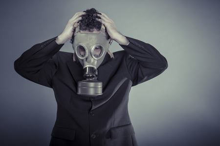 Risk, Business man wearing a gask mask, pollution conceptの写真素材