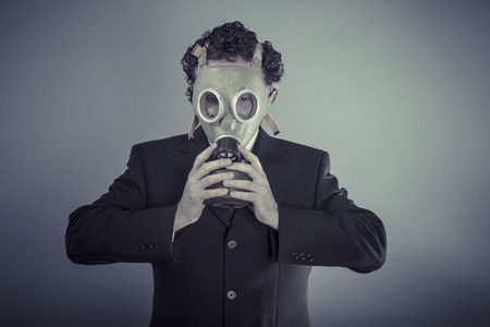 Disaster, Business man wearing a gask mask, pollution conceptの写真素材